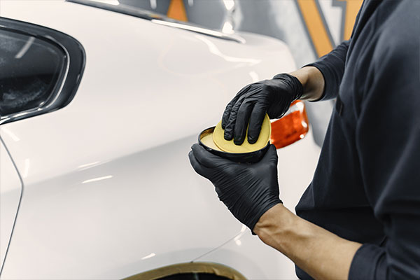 Applying wax on car