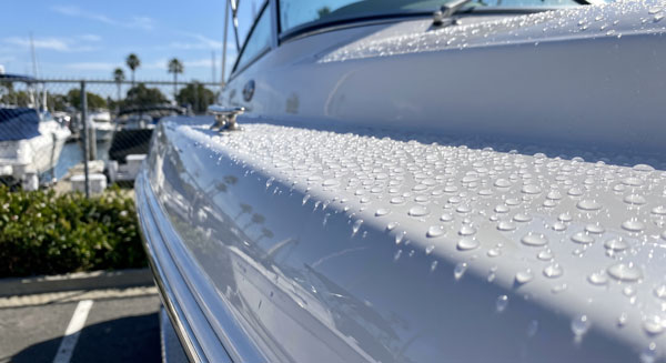 Ceramic coated boat hull with water beading after professional detailing near Lake Elsinore CA Ceramic coated boat hull with water beading after professional detailing near Lake Elsinore CA