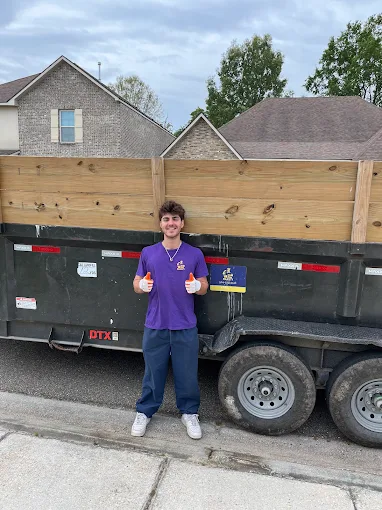 Justin loading furniture into the Junk Majesty truck