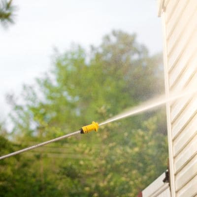 house siding being pressure washed