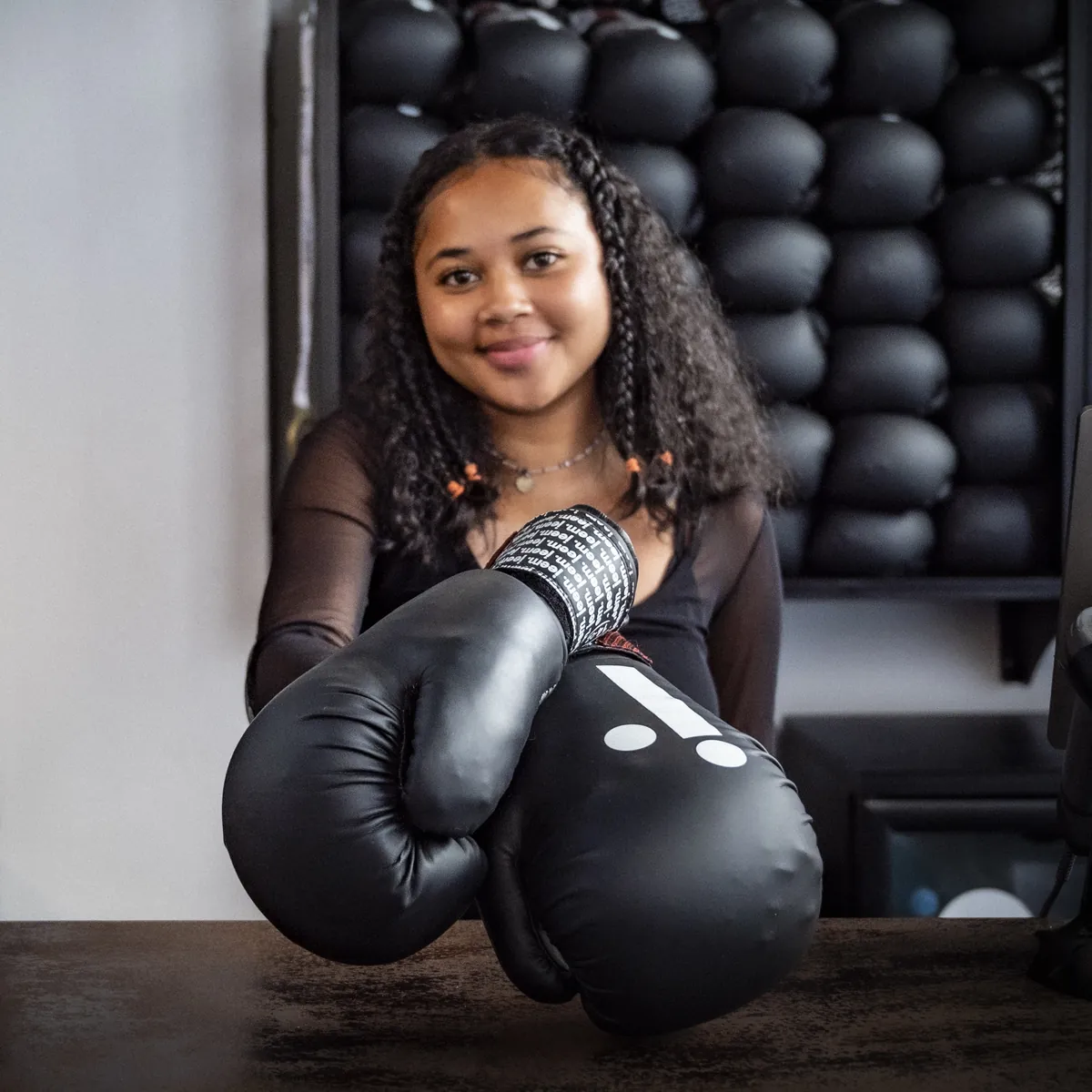 jeem boxing gloves held out over the reception desk