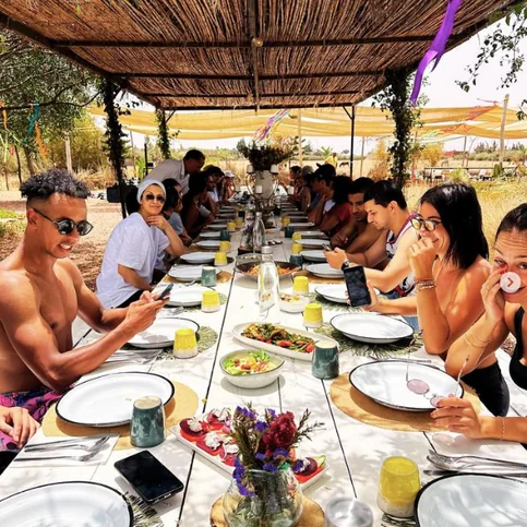 A long lunch table after a team-building session