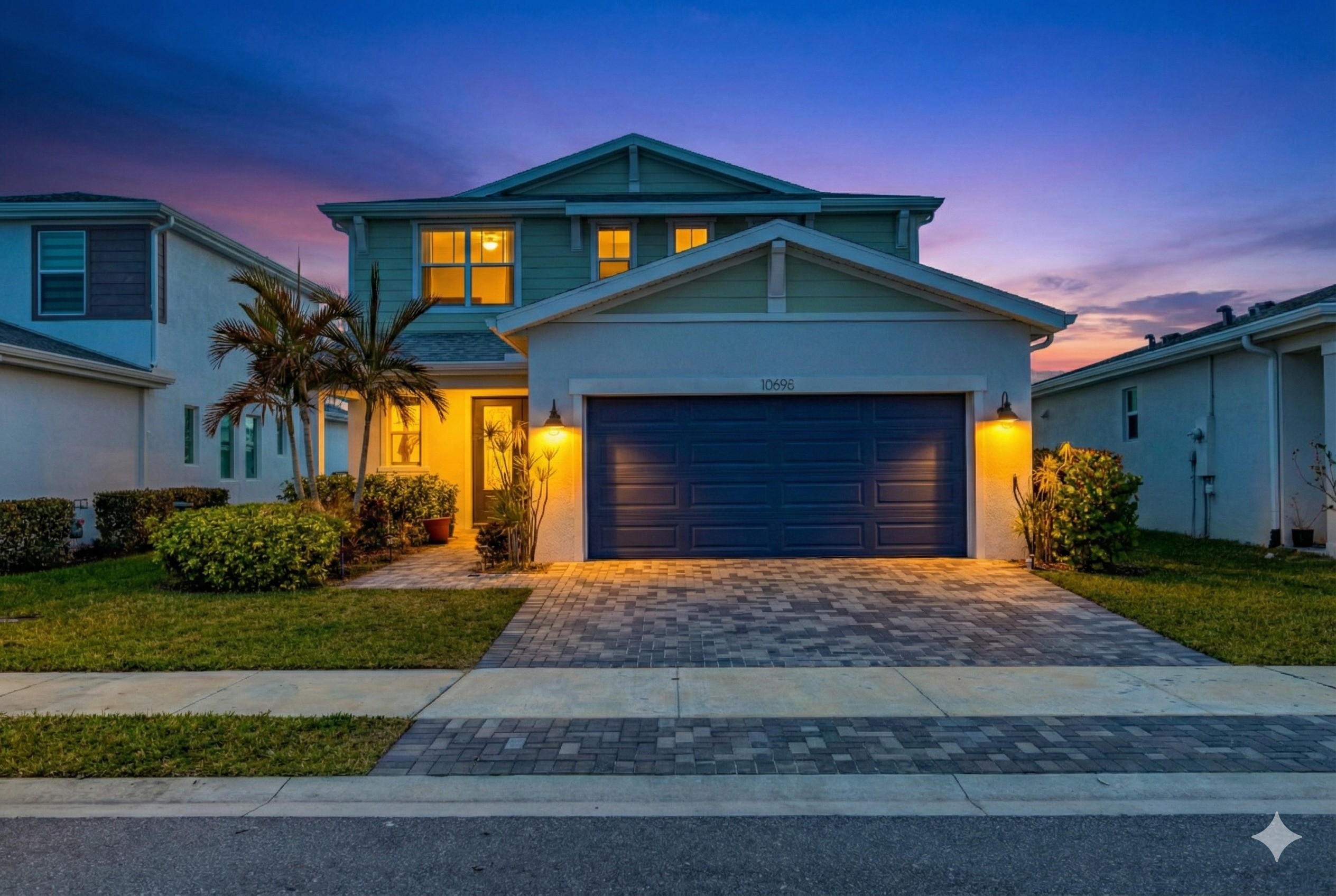 AI-enhanced twilight view of a gray two-story home with illuminated windows