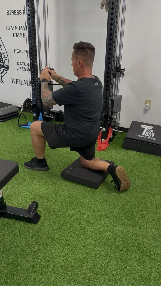 Dr. Austin Pollack evaluating a patient's movement and resilience at For Health Chiropractic