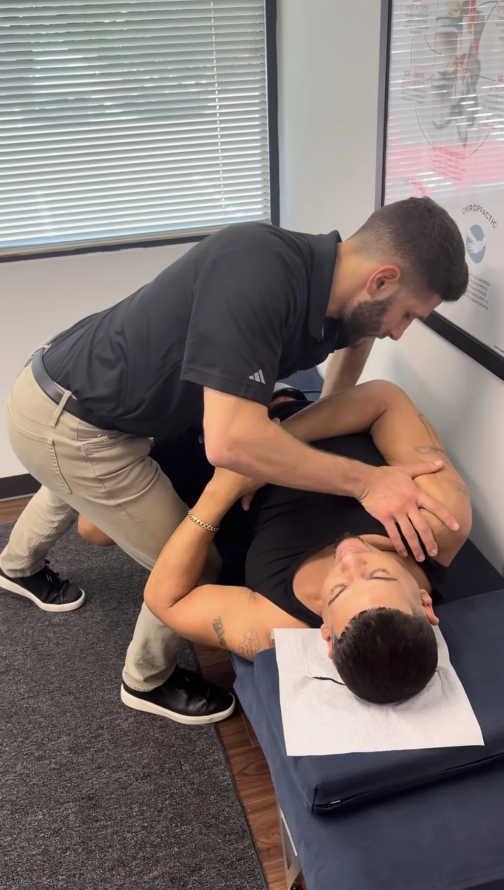 Dr. Austin Pollack providing hands-on chiropractic care at For Health Chiropractic