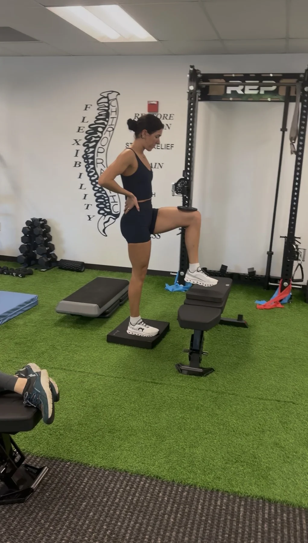 Dr. Austin Pollack evaluating movement and mobility for an athlete at For Health Chiropractic in Warminster, PA