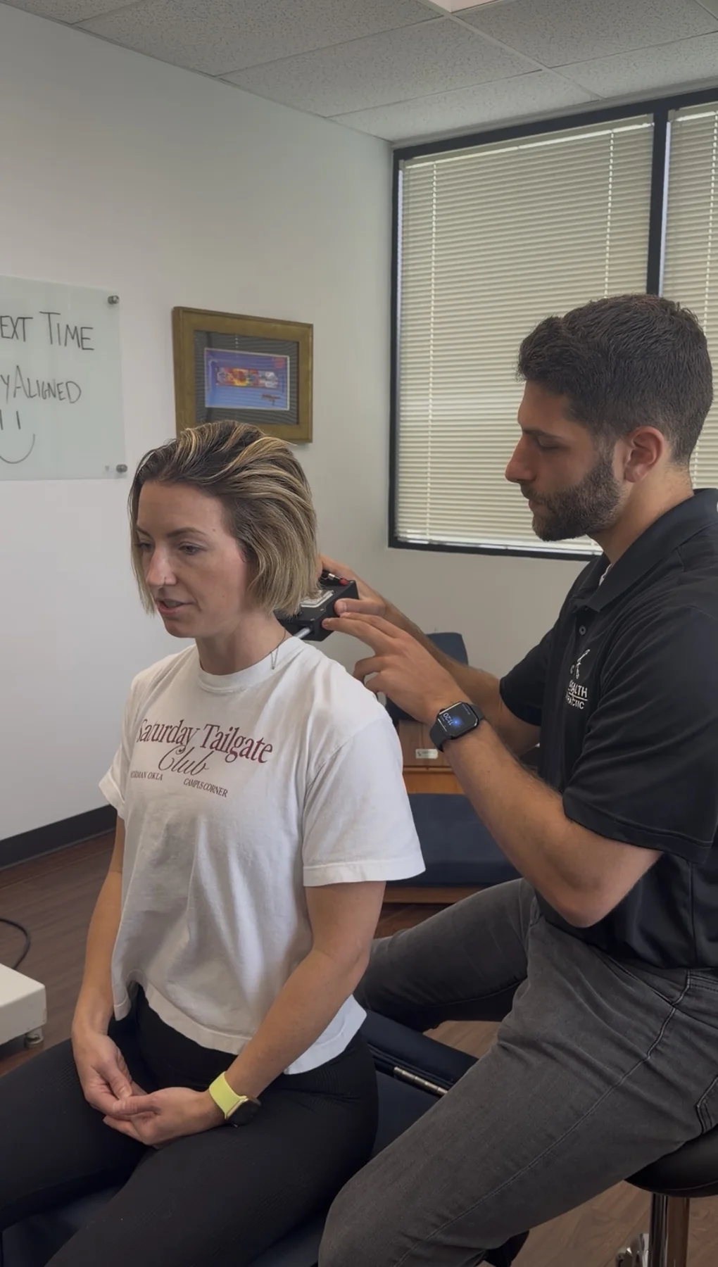 Dr. Austin Pollack guiding a patient through practical posture and movement strategies at For Health Chiropractic
