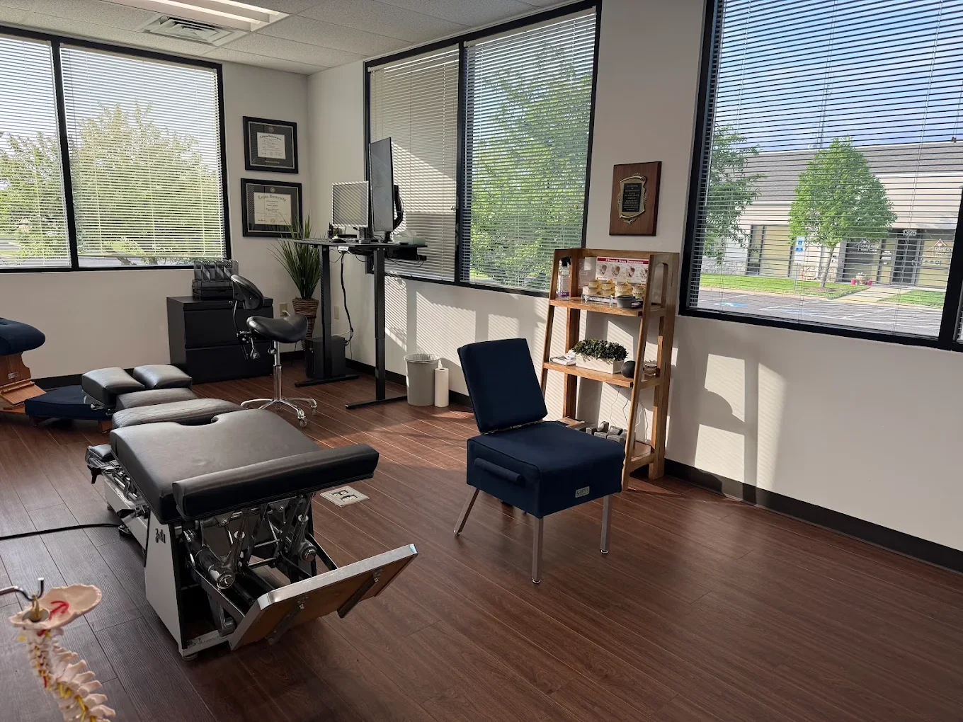 Dr. Austin Pollack consulting with a patient at For Health Chiropractic in Warminster, PA
