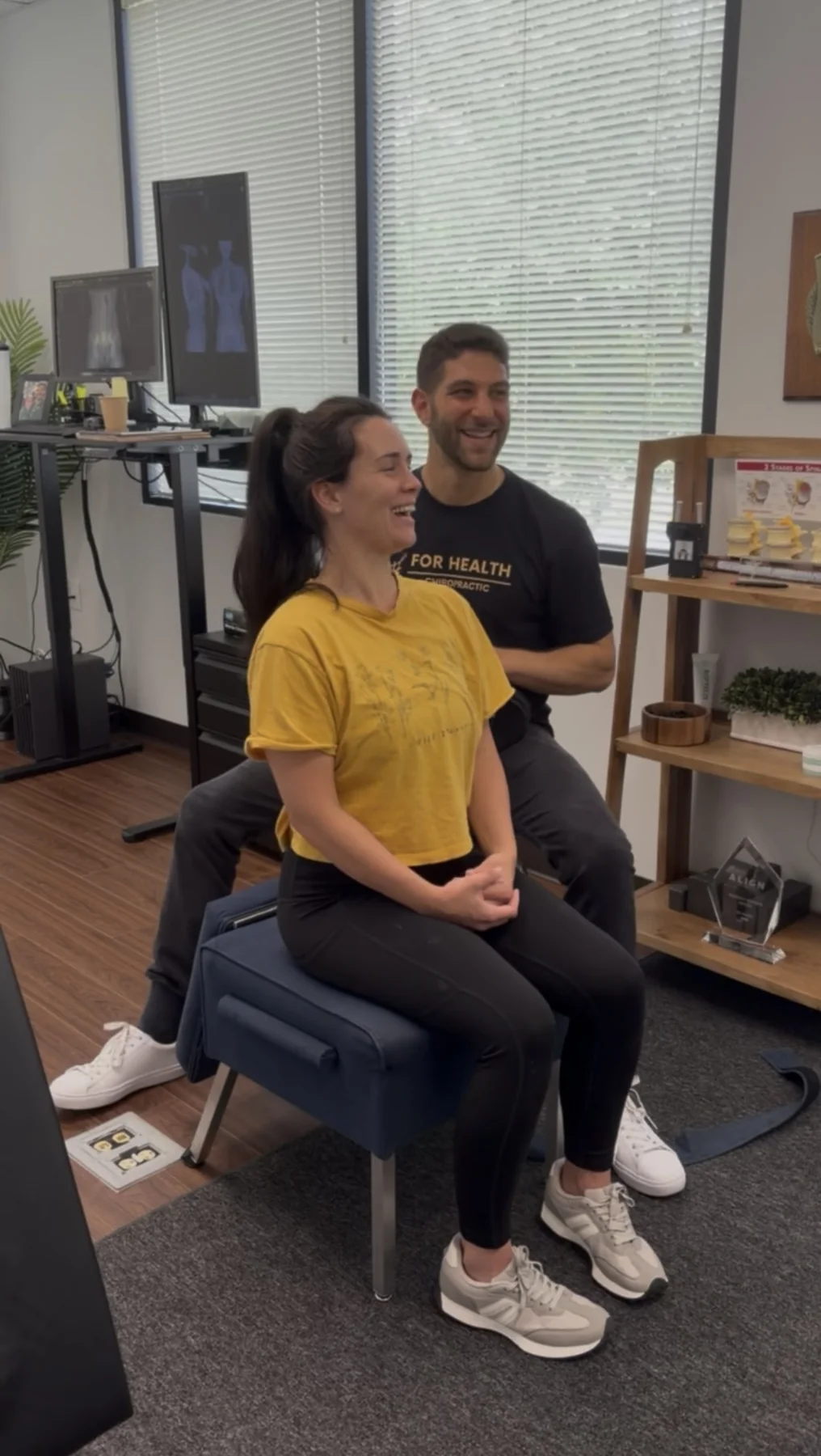 Dr. Austin Pollack evaluating a patient at For Health Chiropractic in Warminster