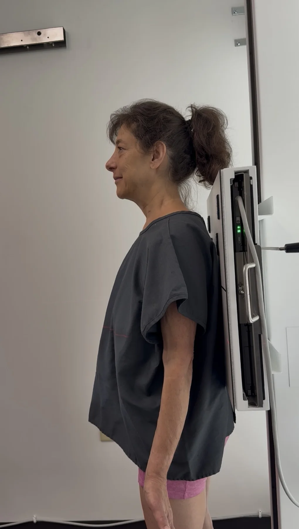 Dr. Austin Pollack evaluating a patient's posture and movement at For Health Chiropractic