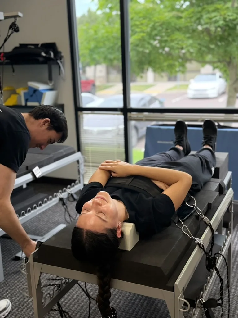 Dr. Austin Pollack providing spine rehabilitation and chiropractic care at For Health Chiropractic
