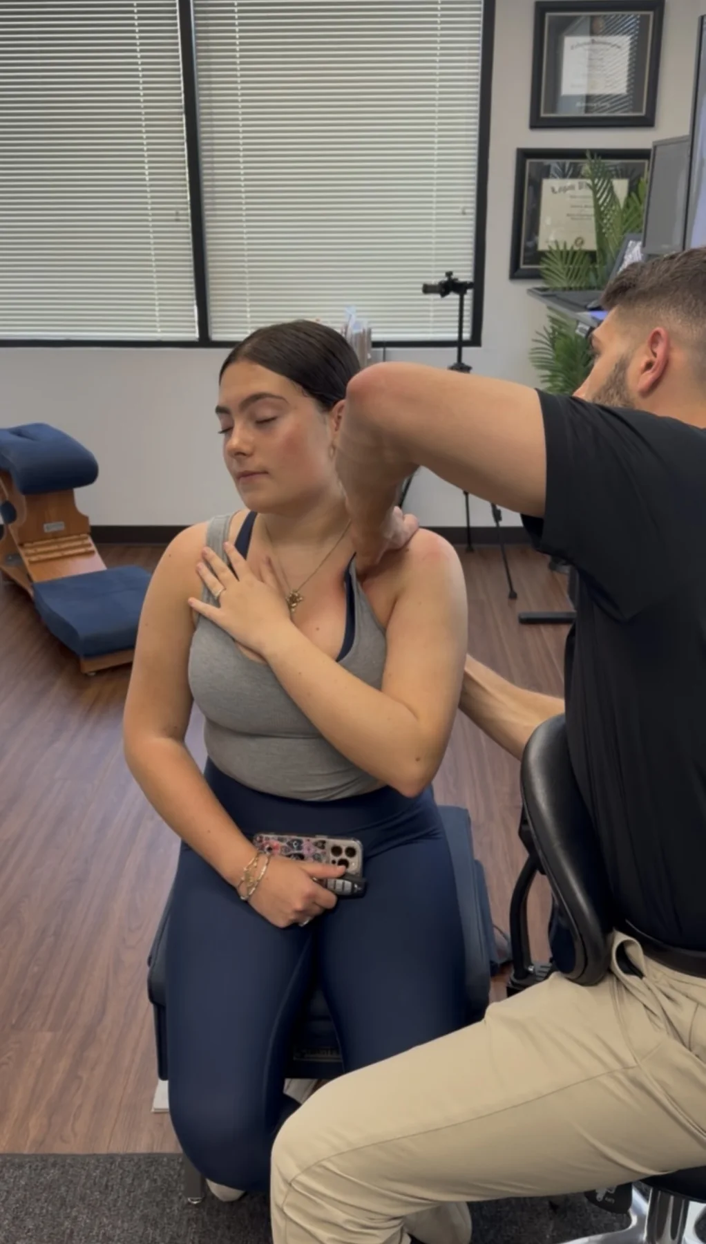 Dr. Austin Pollack providing hands-on conservative care for a patient at For Health Chiropractic