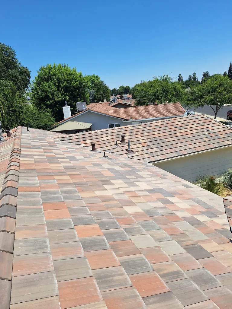 DEK Roofing team reviewing roofing work