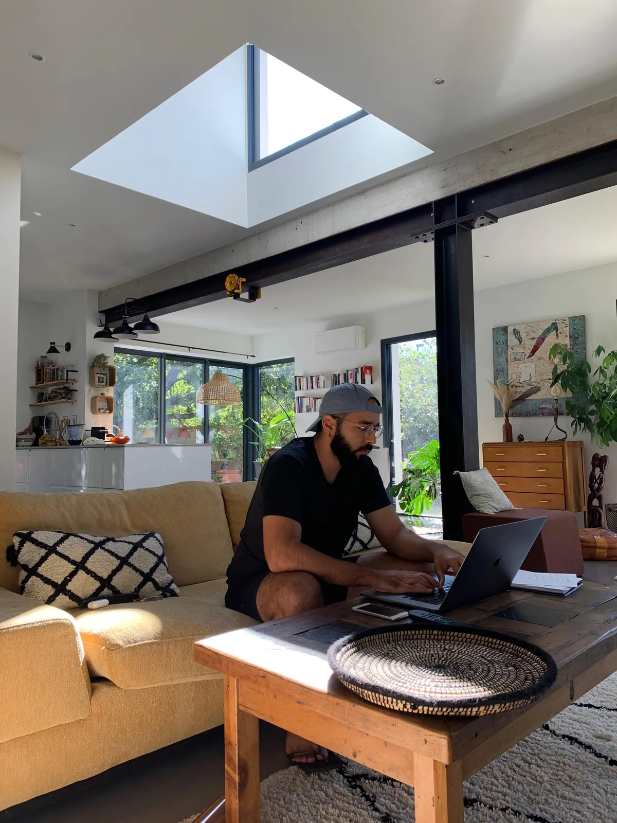 Ari Harden working on a laptop at home