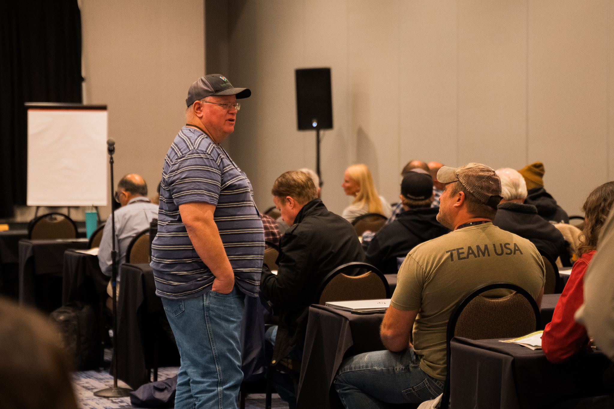 Instructor leading a small-group Eco-Ag U workshop session with seated participants