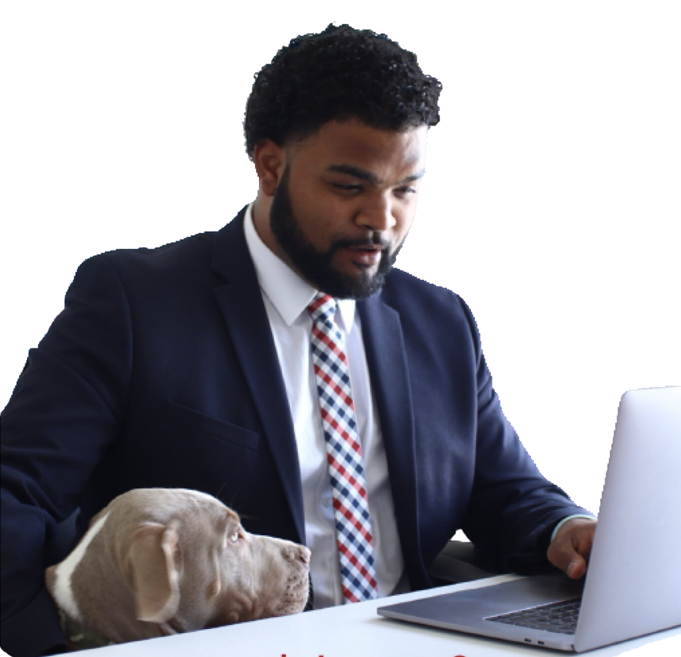 Christ Mateo in a suit using a laptop