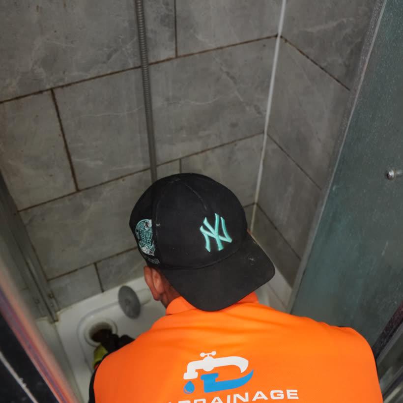 PU Drainage clearing a blocked shower drain