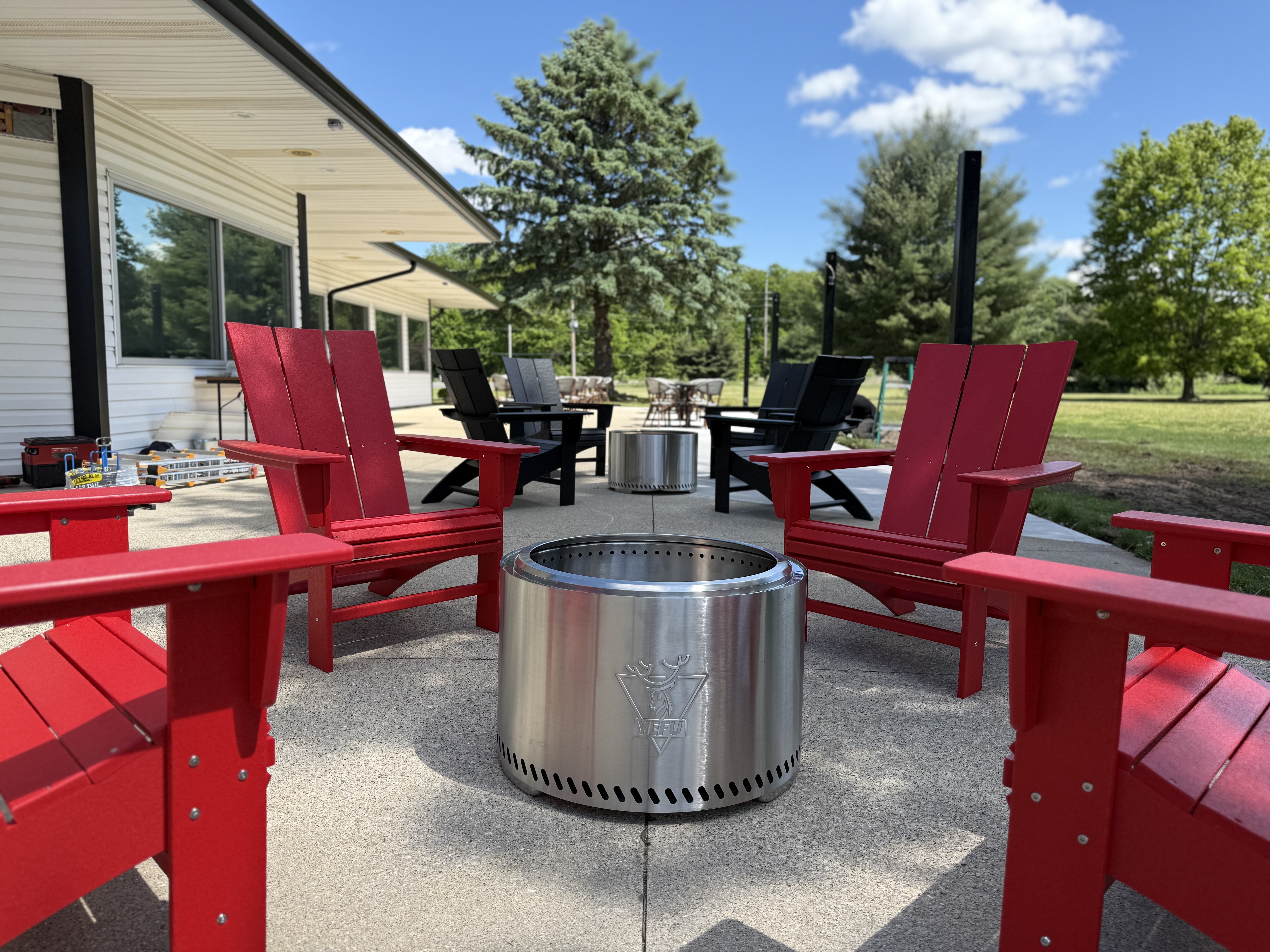 Red POLYWOOD chairs around firepit