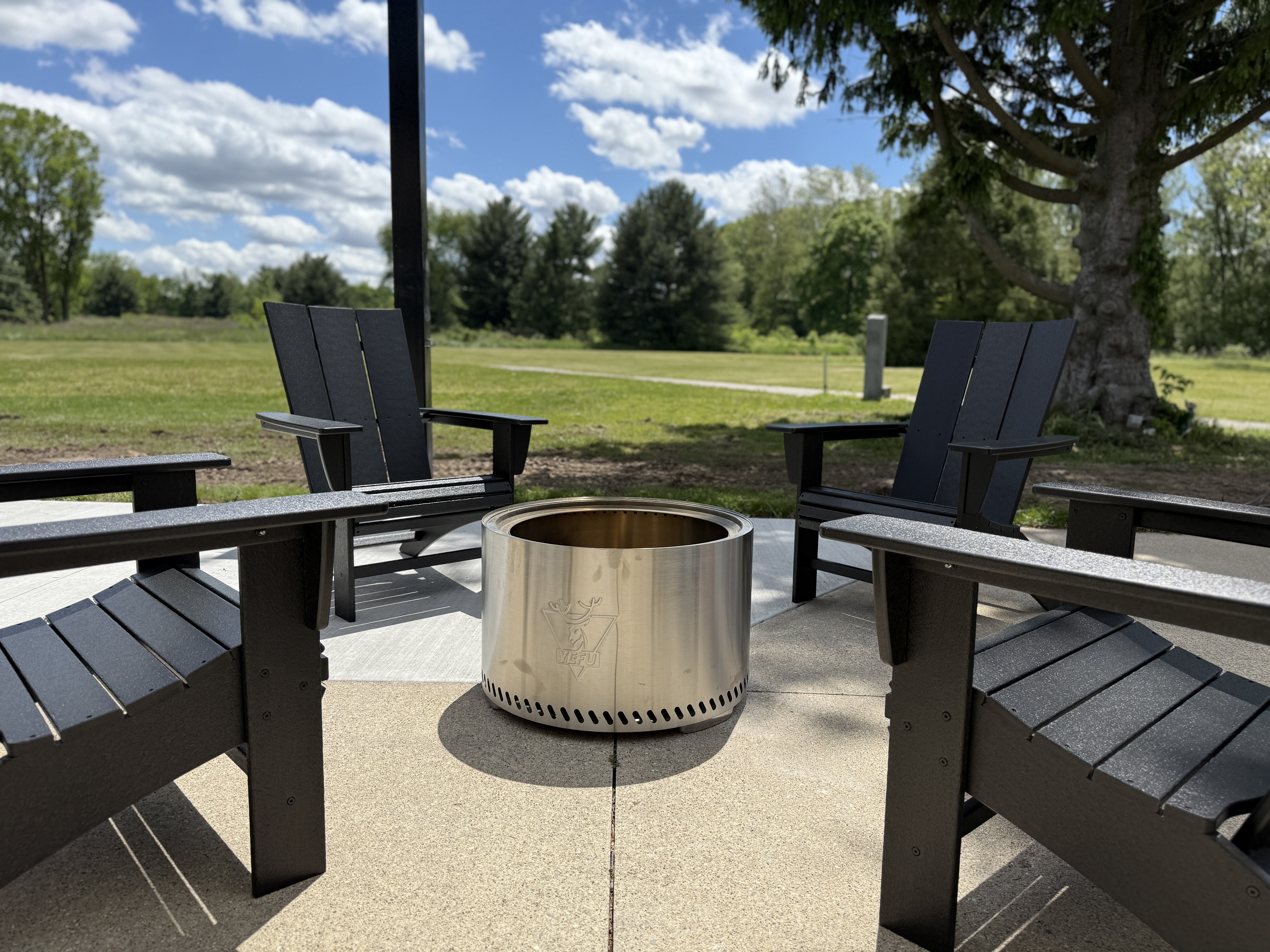 Black POLYWOOD chairs around firepit