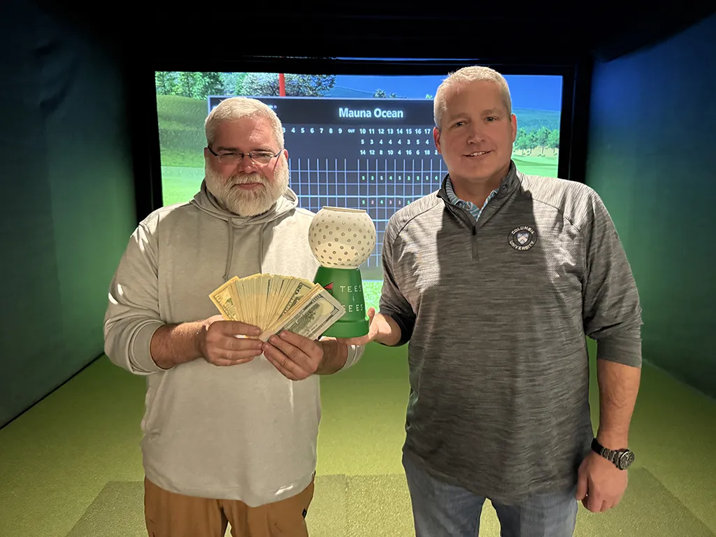 Golf league winners with trophy