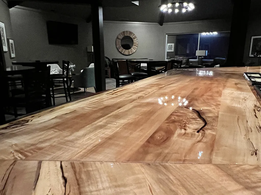 Live-edge bartop looking into the lounge