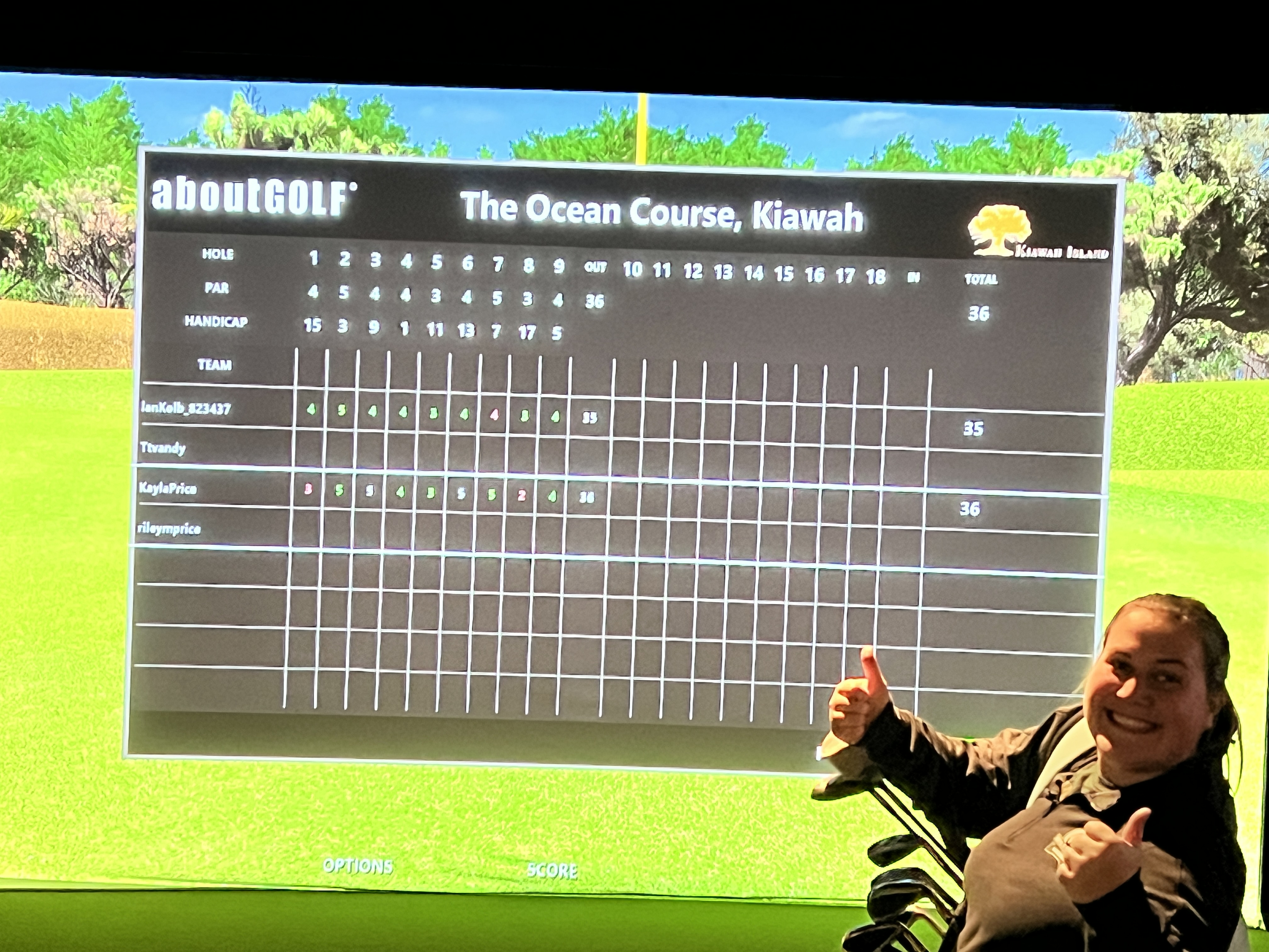 Kayla celebrating a win on the simulator