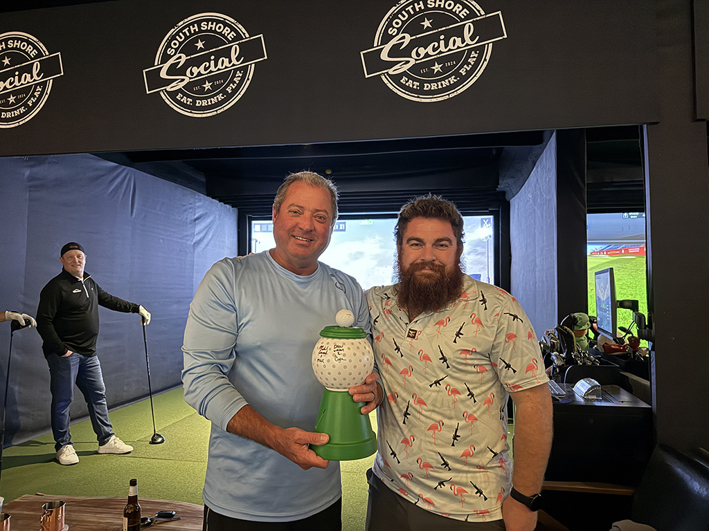 Golf league champions with trophy