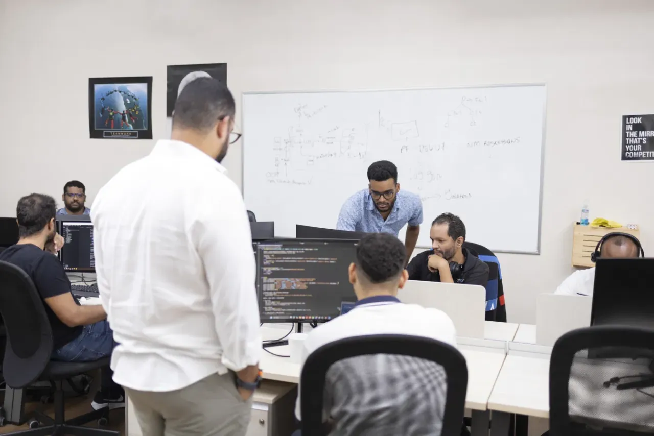 QIS engineers in a whiteboard architecture session