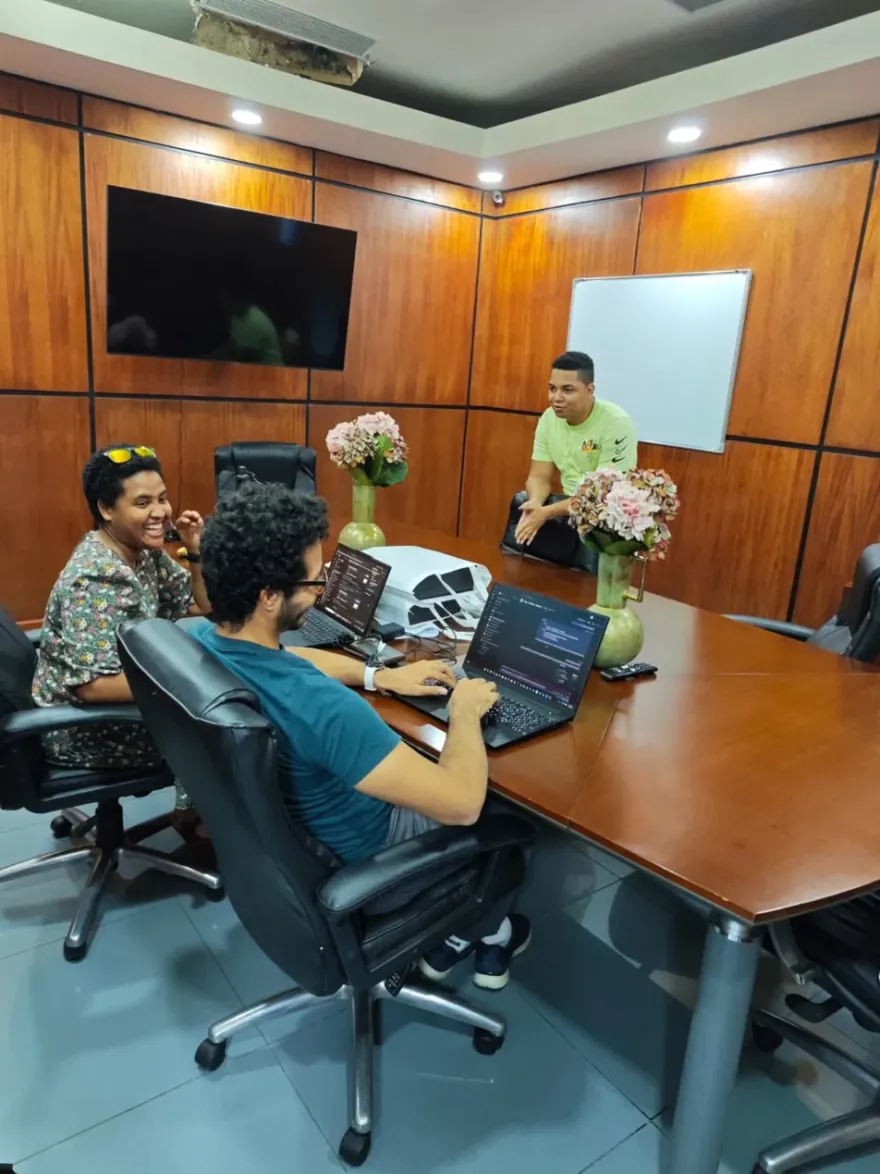 QIS engineers collaborating in a conference room