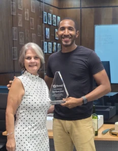 Fagro receiving a five-year recognition award at QIS