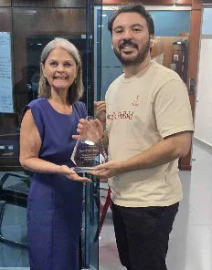 Jacopo receiving a five-year recognition award at QIS