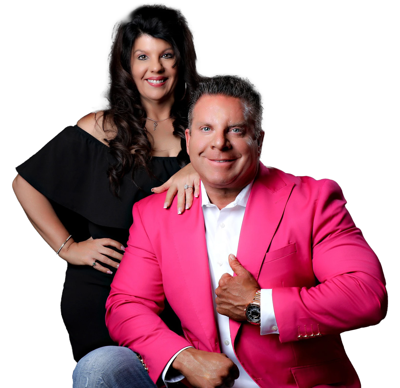 Heath Hall in a bright pink jacket with his wife