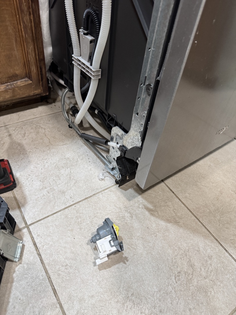 Failed Whirlpool dishwasher drain pump removed during repair in Fairfield California