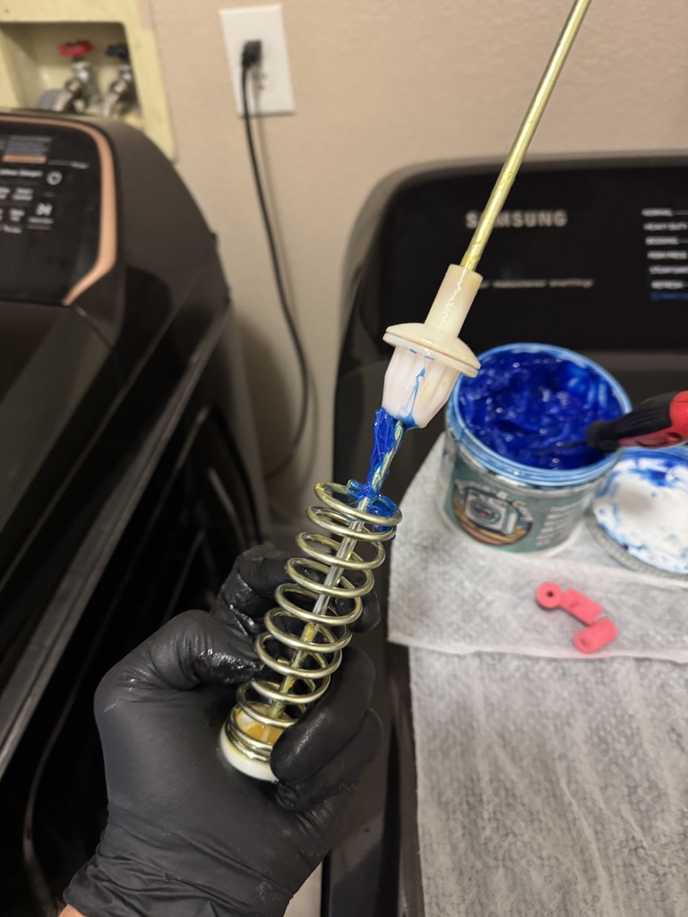 Specialized damping grease applied during Samsung washer suspension restoration
