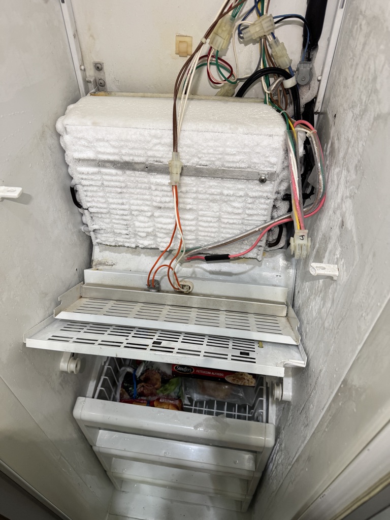 Sub-Zero freezer evaporator covered in heavy frost during defrost diagnosis