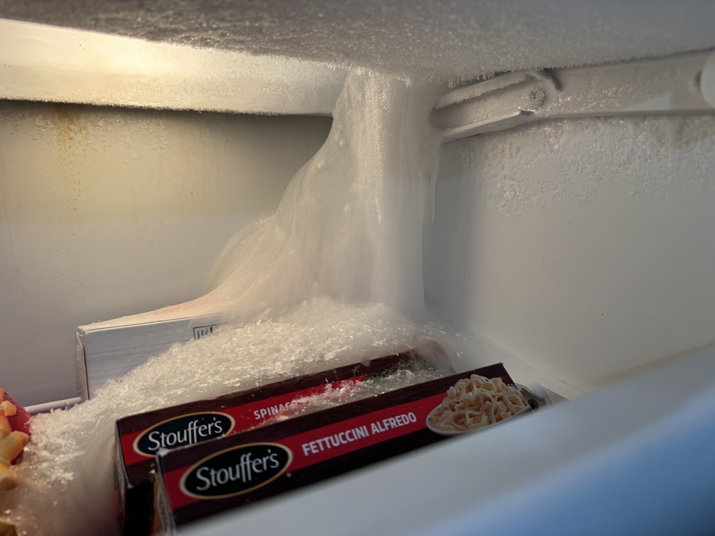 Heavy ice buildup inside a Sub-Zero freezer before defrost-system repair in Citrus Heights