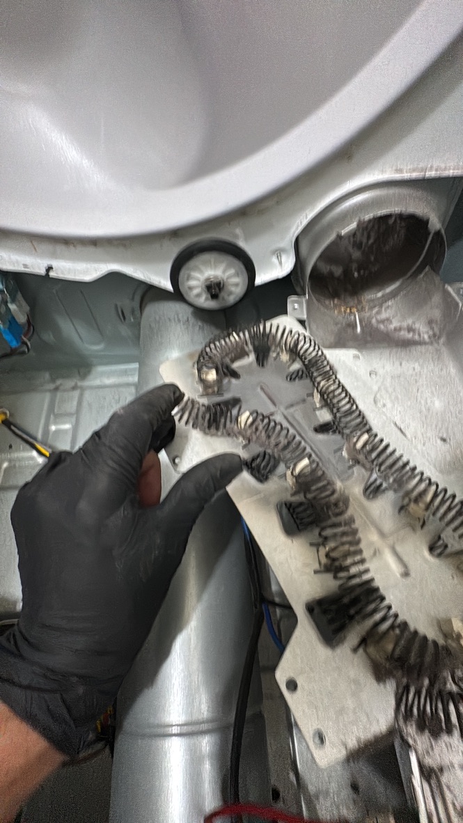 Old Samsung dryer heating element removed during a Fairfield heating repair