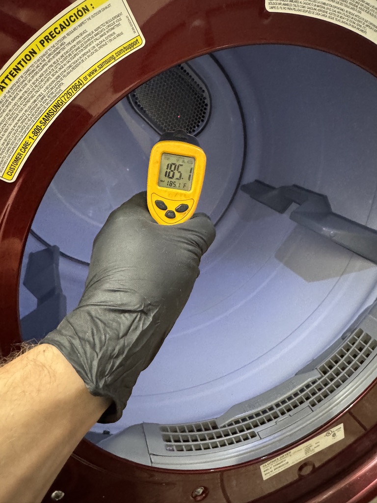 Infrared surface-temperature check inside the Samsung dryer after heating element replacement