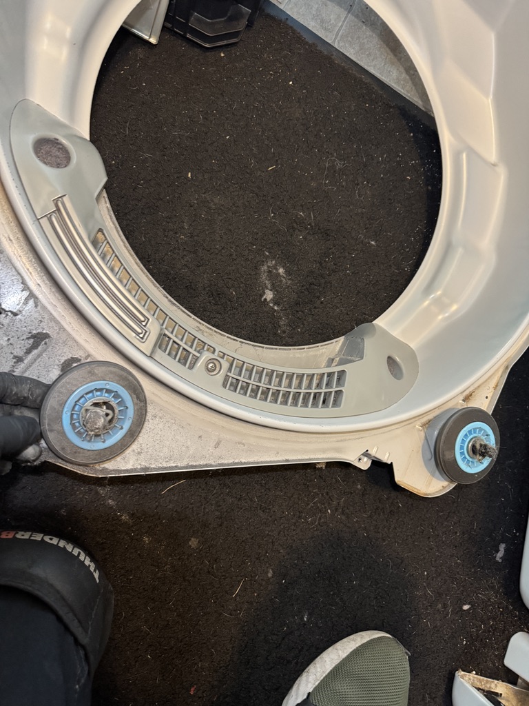 Front drum-support assembly and rollers removed from a Samsung dryer for inspection