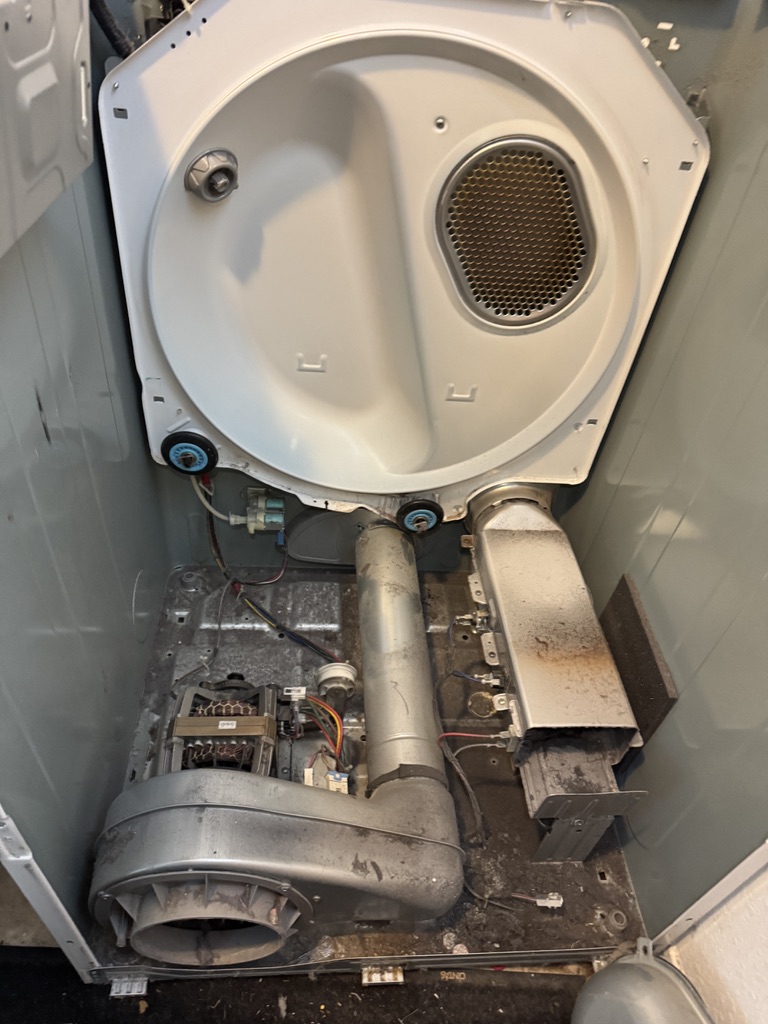 Samsung dryer opened with the drum removed during grinding-noise diagnosis in Rancho Cordova
