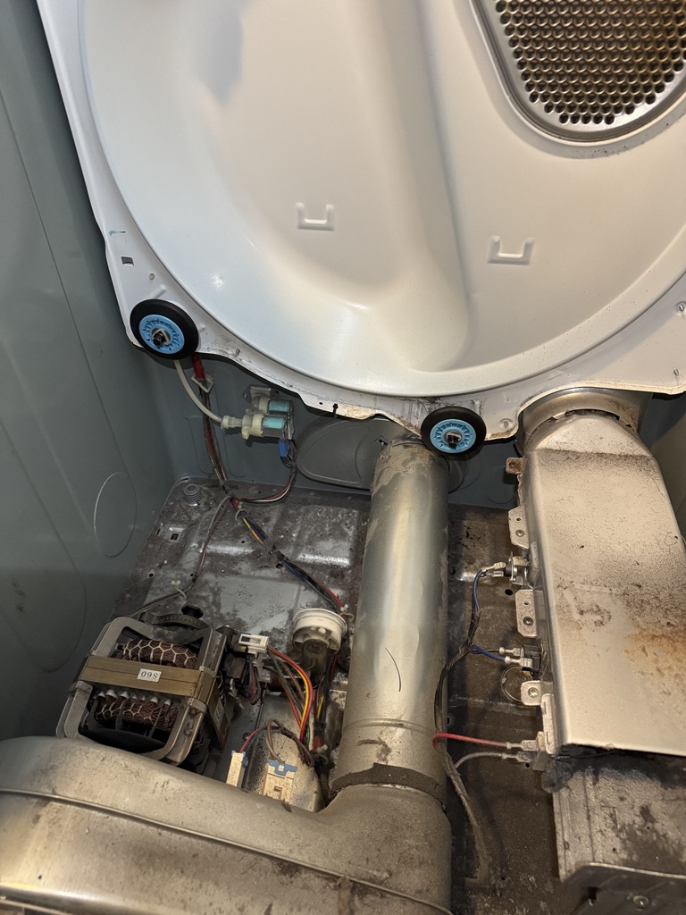 Replacement rear drum support rollers fitted in the Samsung dryer during noise repair
