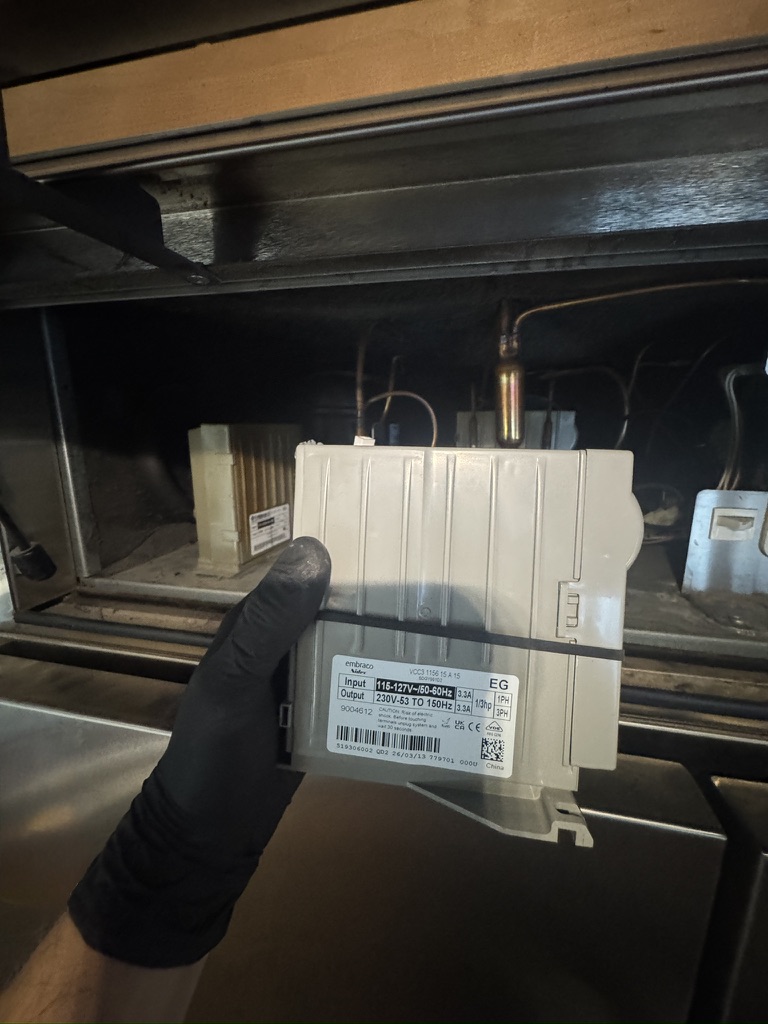 Compressor inverter module handled during Sub-Zero freezer repair Compressor inverter module handled during Sub-Zero freezer repair