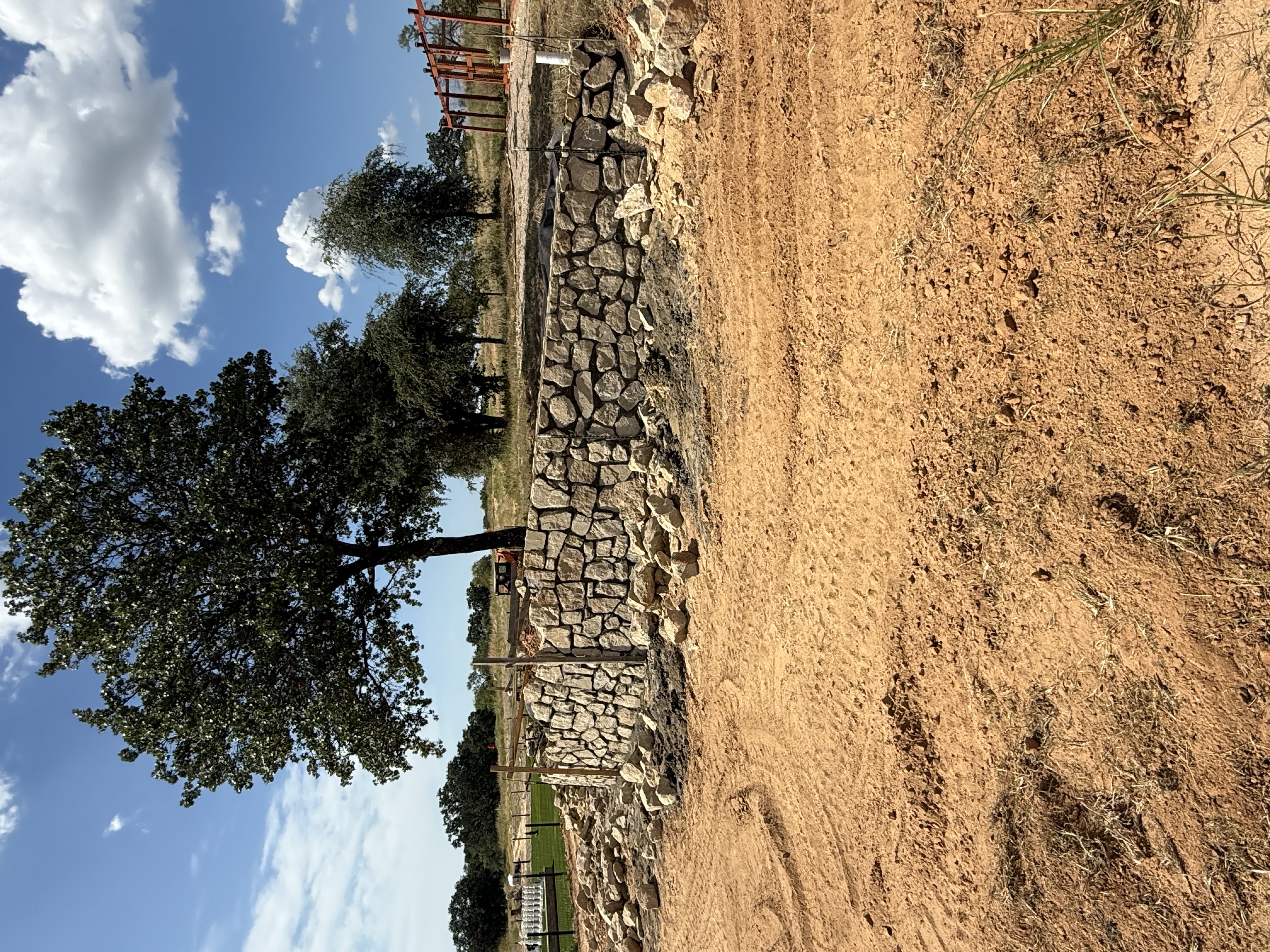 Landscape retaining wall built on a sloped yard in Weatherford, TX