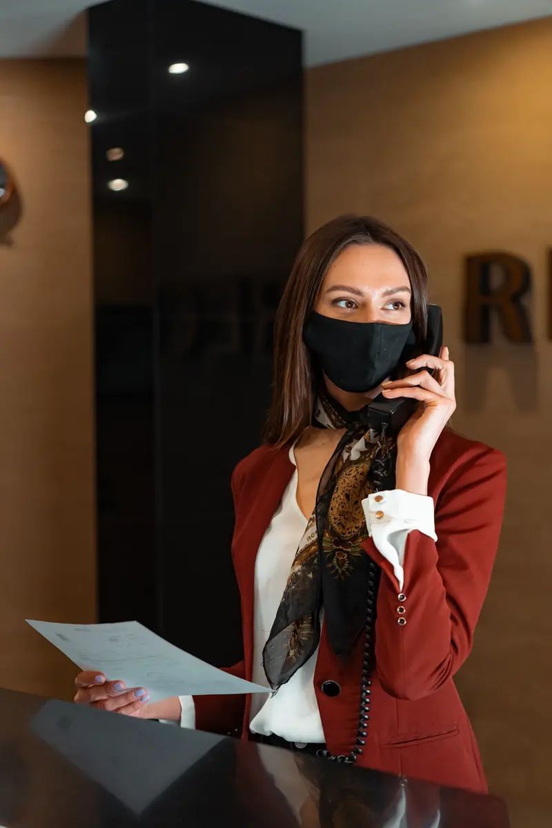 Clinic receptionist handling treatment inquiry