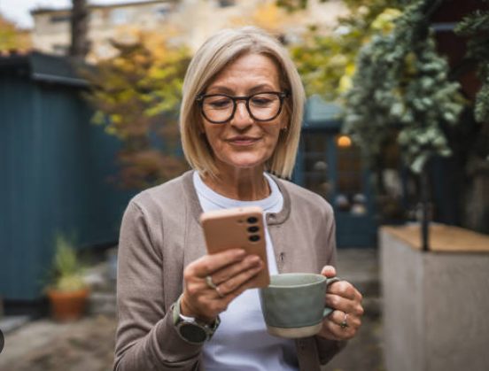 A woman reading a text on her phone