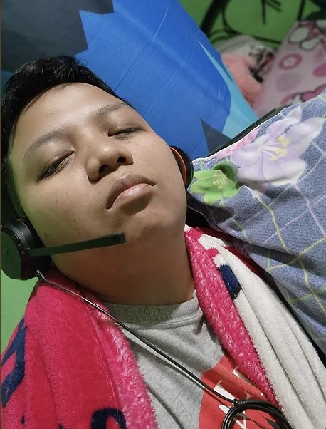 Throwback: Bhryx asleep with a call-center headset on during the BPO days