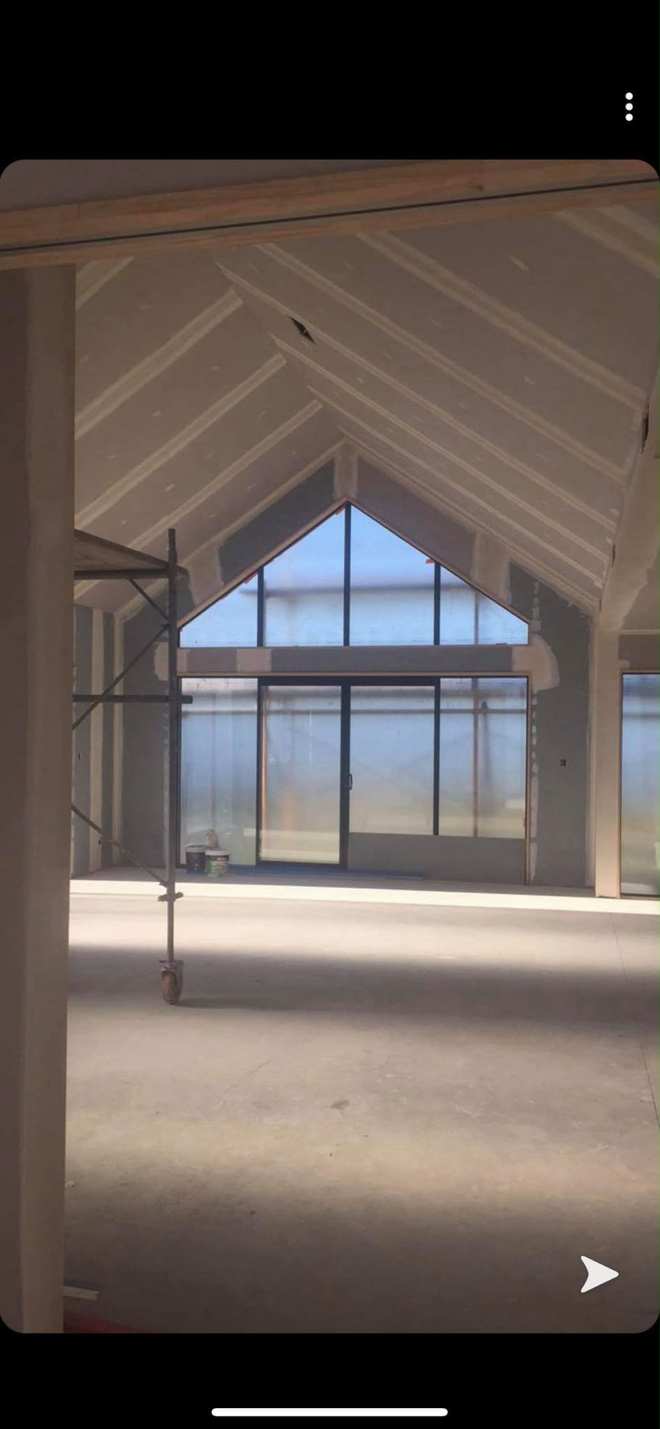 Interior plastering and stopping preparation across hallway and high ceilings