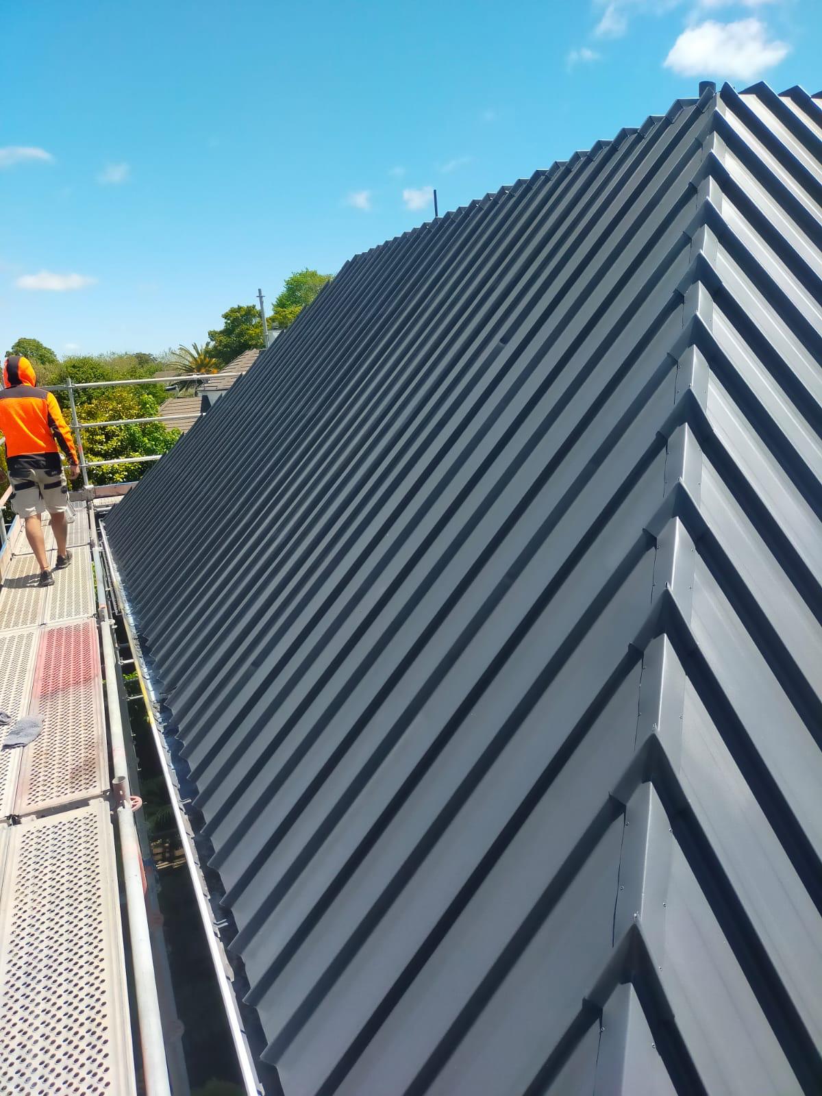 Long-run corrugated Ironsand roof freshly painted on a Christchurch home