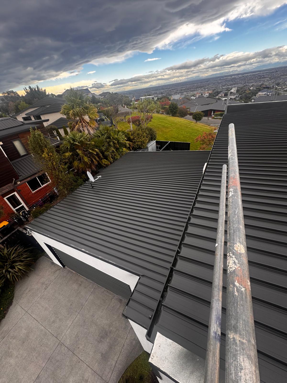 Westmorland house roof spray on the Port Hills, Christchurch, with Resene roof paint ahead of sale