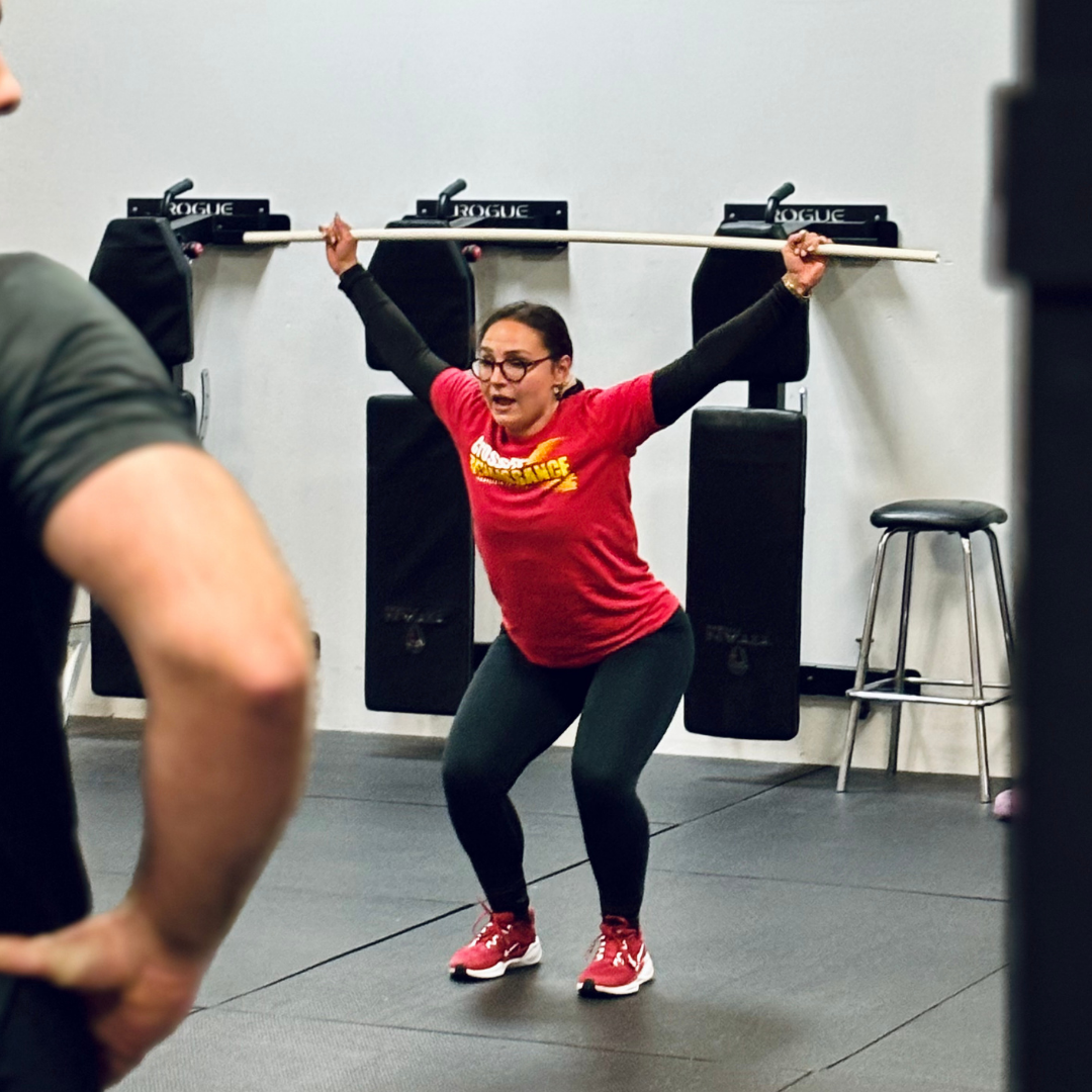 CrossFit Renaissance coach demonstrating an overhead movement